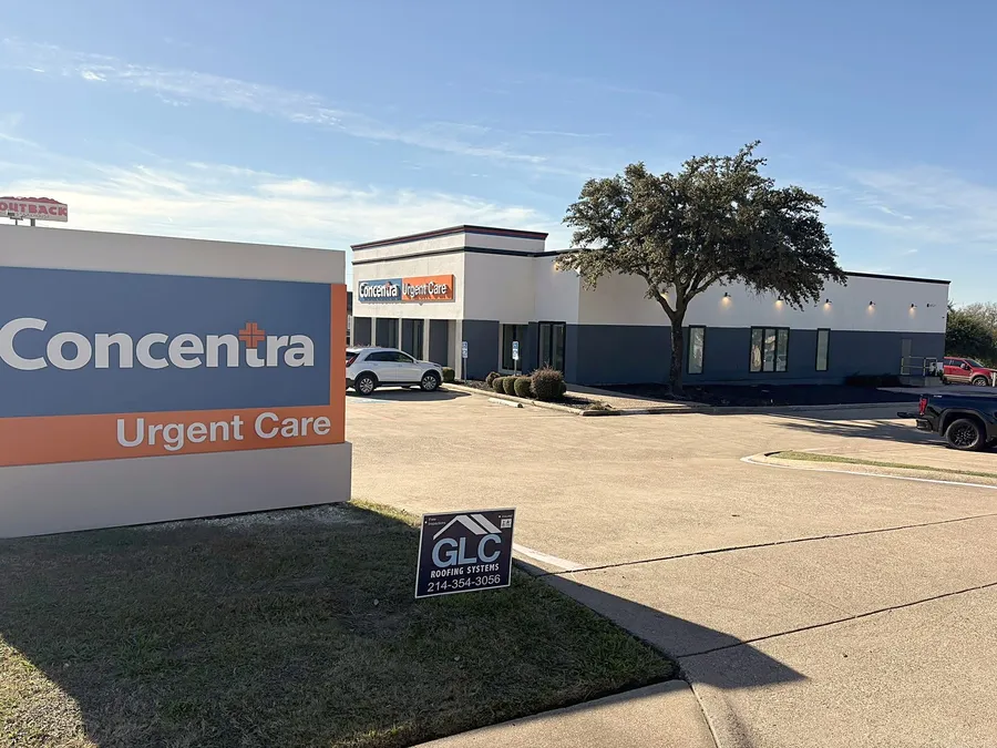 The Concentra Urgent Care building where GLC installed a TPO roof, with the GLC sign on the lawn
